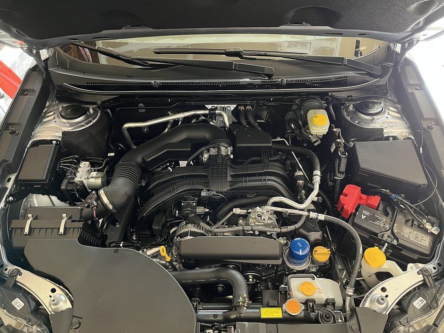 Modern four-cylinder engine bay with covers and fluid reservoirs